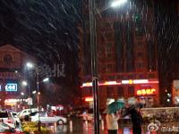 北京迎来今冬首场降雪 市民换上冬衣