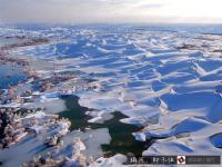 航拍塔克拉玛干沙漠雪景 宛若童话世界