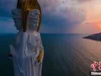 航拍夕阳下三亚南山108米海上观音像