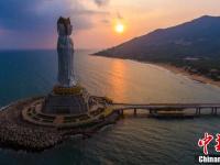 航拍夕阳下三亚南山108米海上观音像