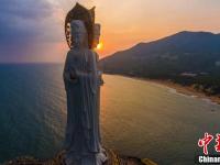 航拍夕阳下三亚南山108米海上观音像