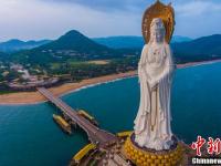 航拍夕阳下三亚南山108米海上观音像